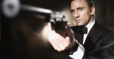 daniel craig james bond 007 silencer on gun pointing it