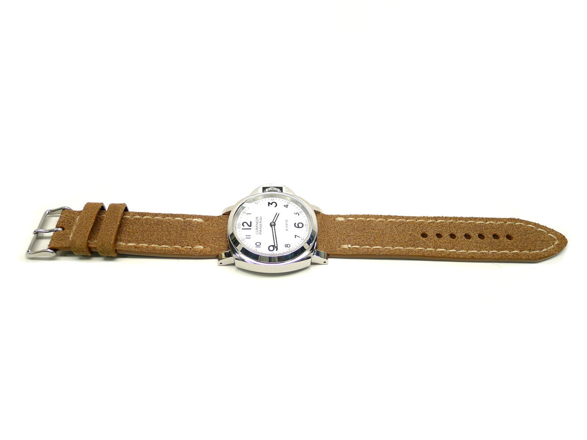 Banistan watch strap in tan with cream edge stitching, shown fitted to a watch.