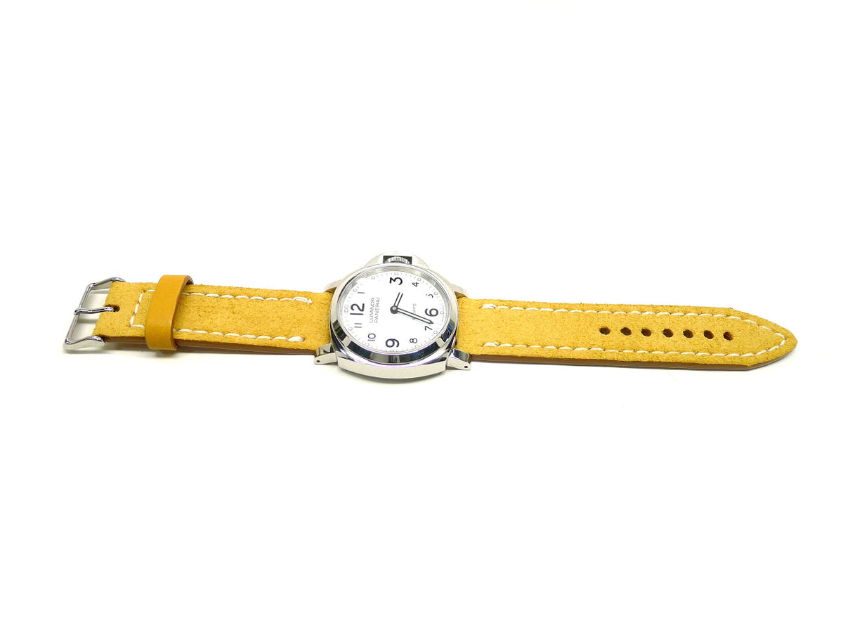 Deerlow watch strap in yellow with cream edge stitching, shown fitted to a watch.