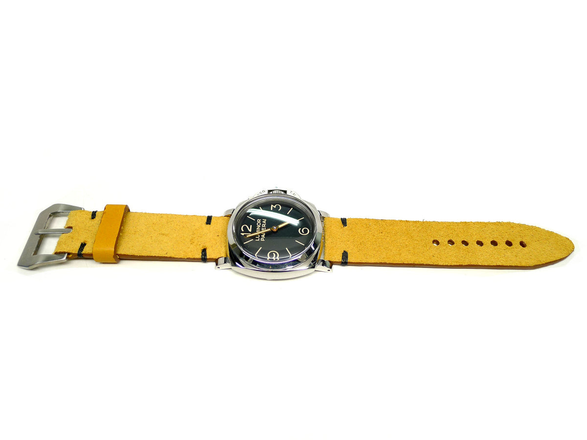 Demeter watch strap in yellow with a textured surface and dark accent stitches, shown fitted to a watch.