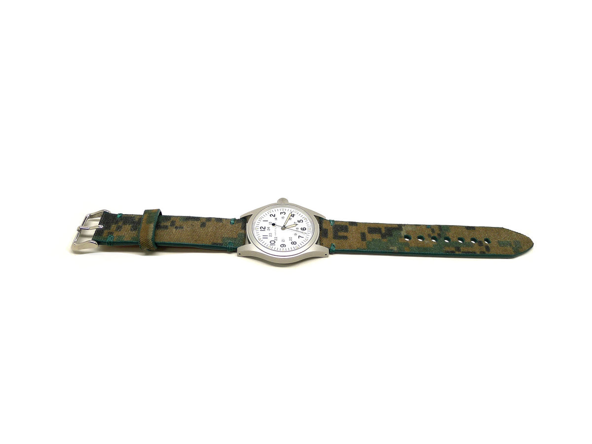 Honor watch strap in green and brown with a block camouflage pattern, shown fitted to a watch.