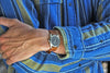 Arms Folded And A Genuine Handmade Horween Shell Cordovan Rally Watch Band In Natural By DaLuca Straps.