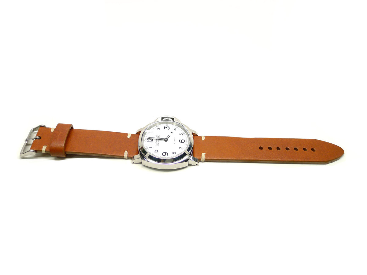 Spunkoh watch strap in orange brown with white accent stitches, shown fitted to a watch.