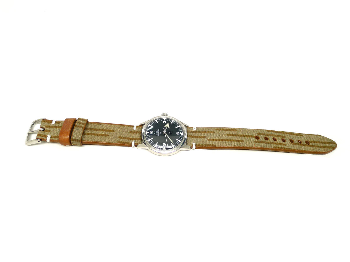 Surge watch strap in tan with brown stripes and a brown keeper, shown fitted to a watch.