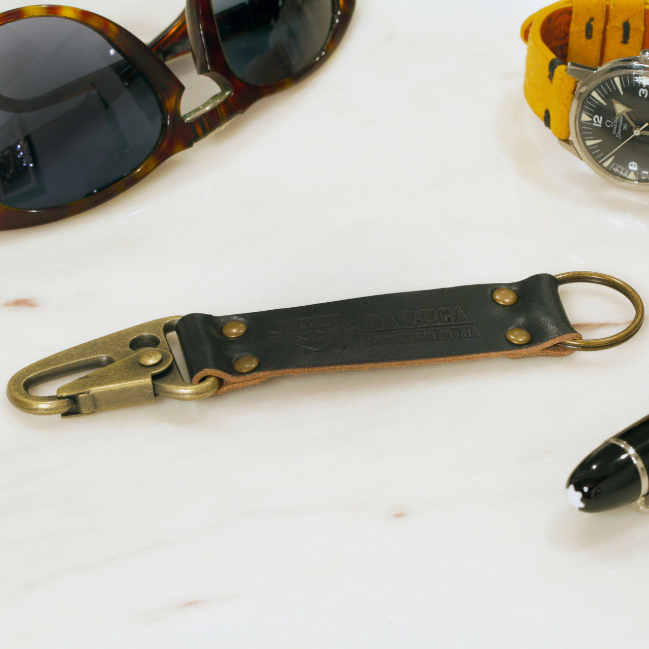 Close View Of Our Keychain Made From Genuine Horween Black Chromexcel Leather and Antique Brass Hardware by DaLuca Straps.