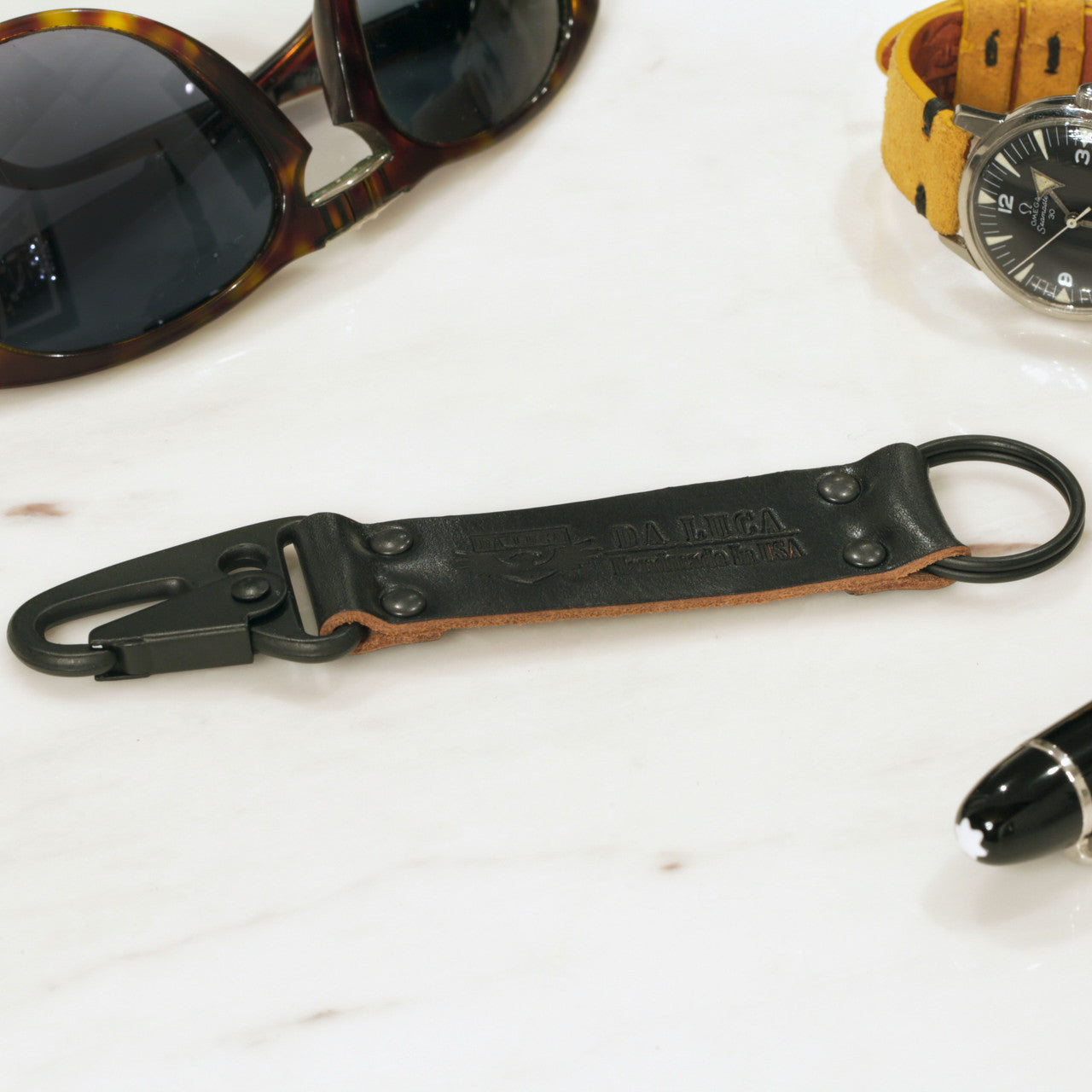 Close View Of Our Keychain Made From Genuine Horween Black Chromexcel Leather and PVD Hardware by DaLuca Straps.