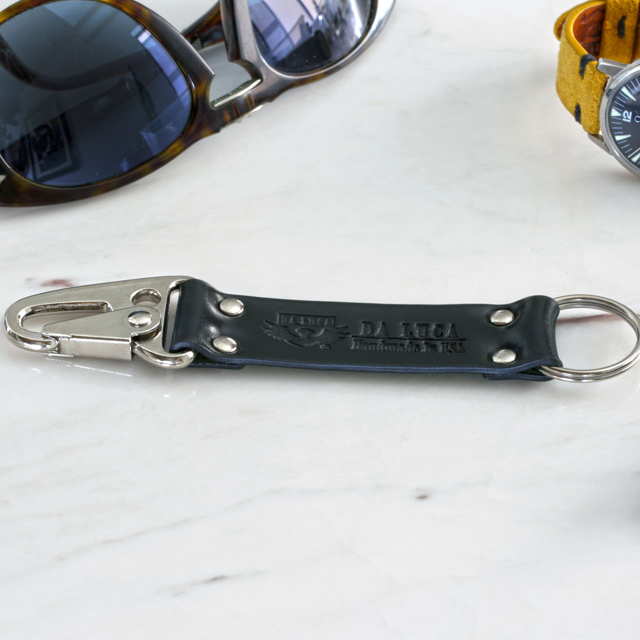 Close View Of Our Keychain Made From Genuine Horween Black Shell Cordovan Leather and Polished Hardware by DaLuca Straps.