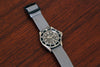 Braided Nylon Perlon Watch Strap Grey PVD Buckle Wood Angle By DaLuca Straps.