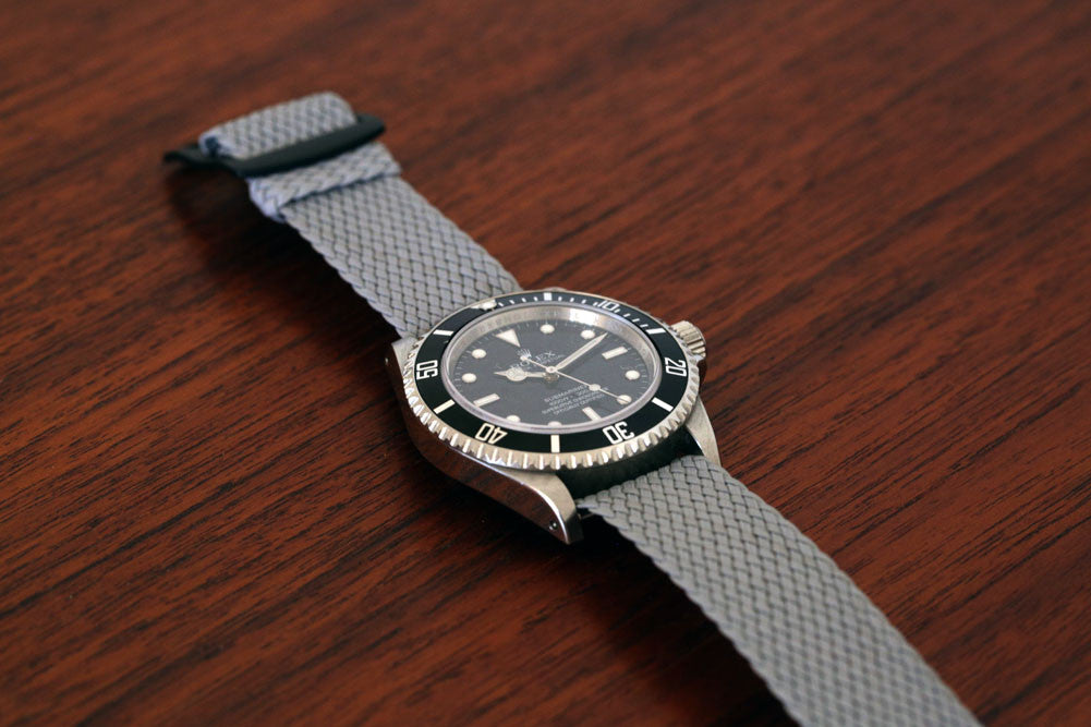 Braided Nylon Perlon Watch Strap Grey PVD Buckle Wood Angle By DaLuca Straps.