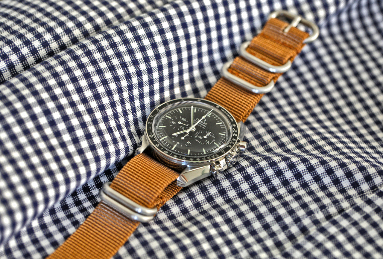 A Light Brown Ballistic Nylon Military Watch Strap With A Matte Silver Buckle By DaLuca Straps.