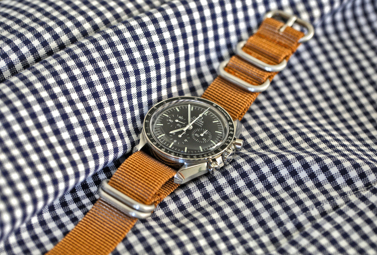 A Light Brown Ballistic Nylon Military Watch Strap With A Matte Silver Buckle By DaLuca Straps.