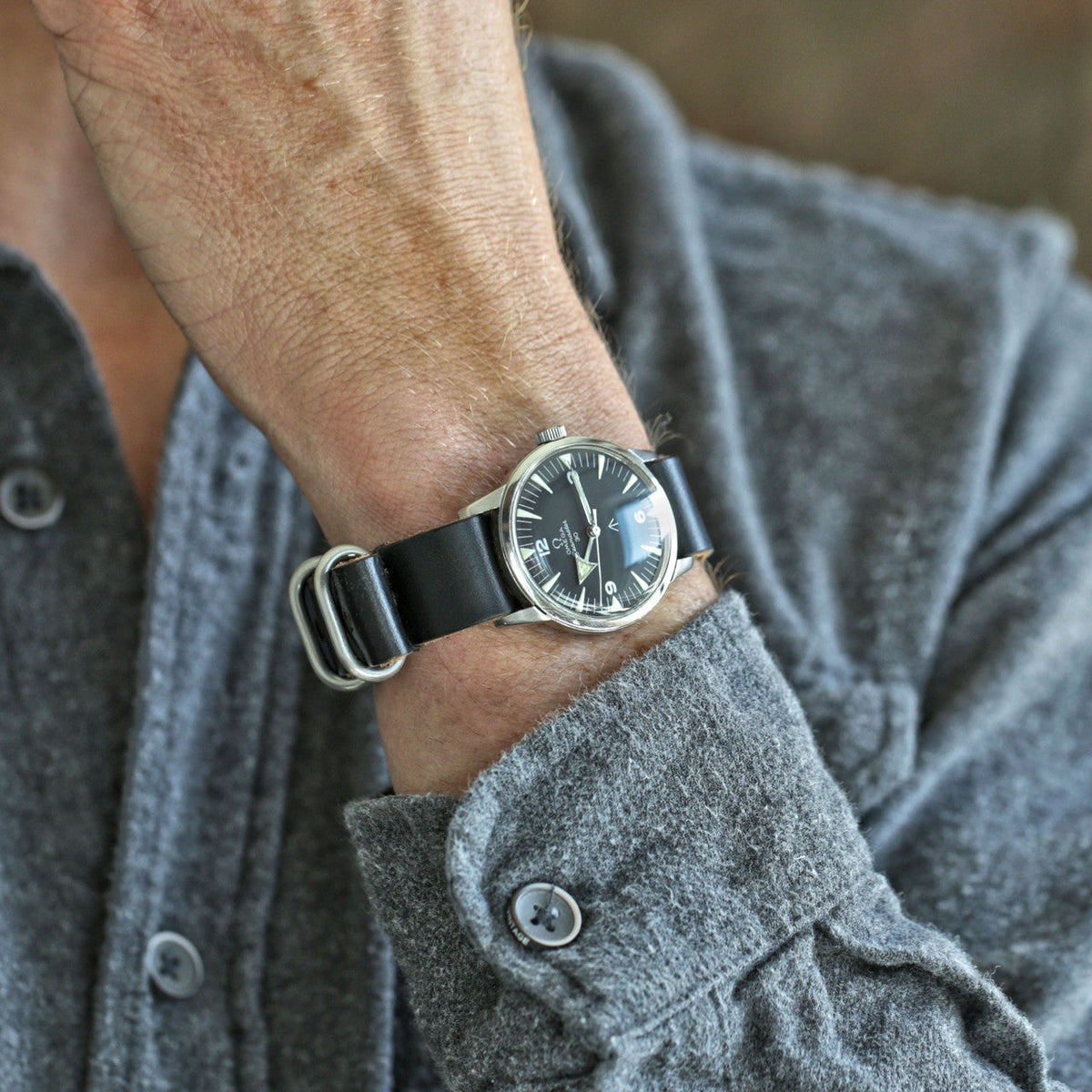 Single Piece Leather Military Watch Strap Made From Black Chromexcel With Matte Silver Hardware By DaLuca Straps.