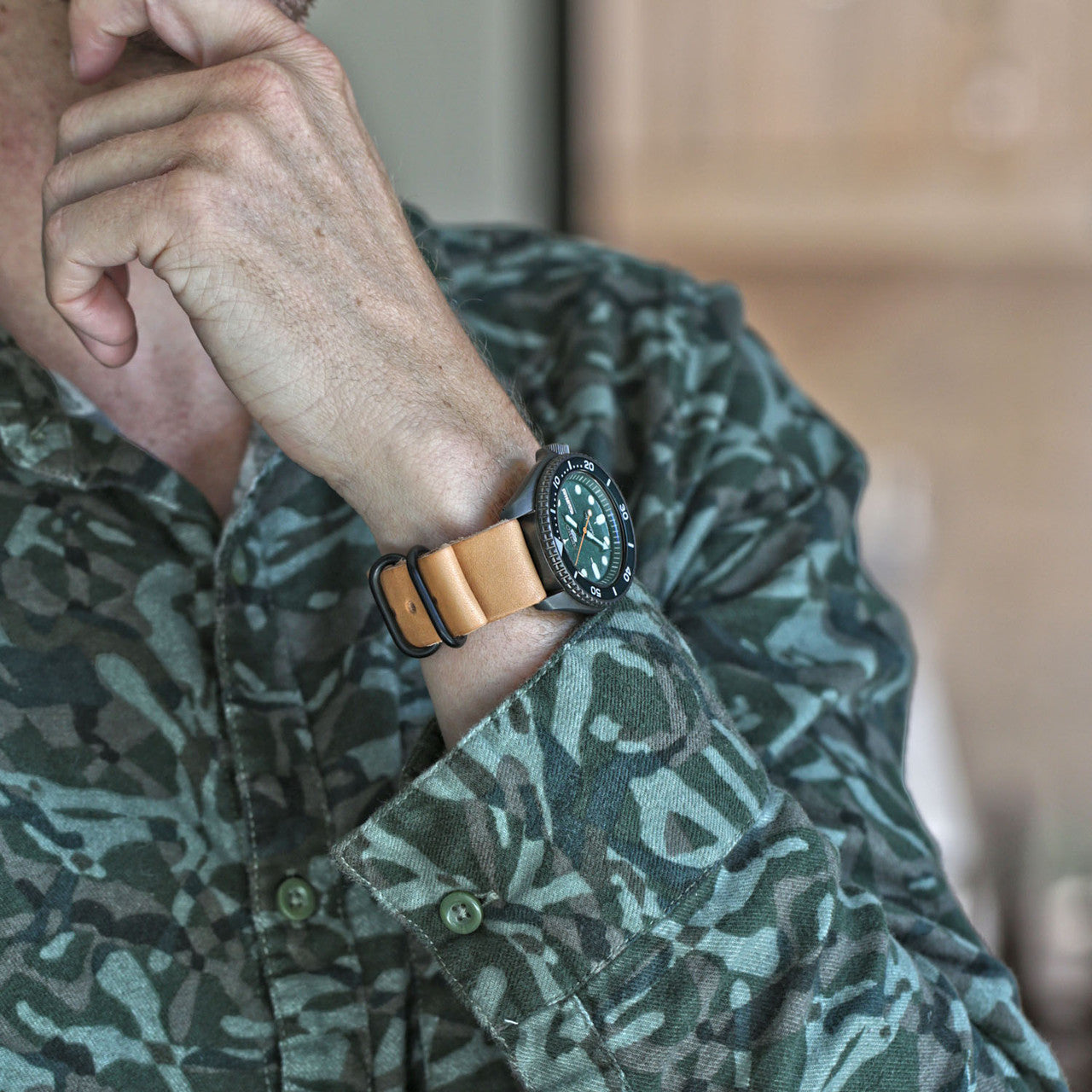 A Military Single Piece Watch Strap Made From Horween Natural Essex With A PVD Buckle By DaLuca Straps.