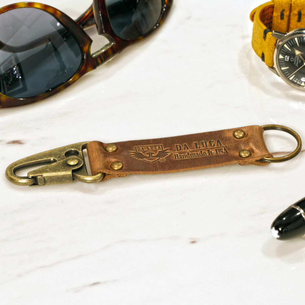 Close View Of Our Keychain Made From Genuine Horween Natural Chromexcel Leather and Antique Brass Hardware by DaLuca Straps.