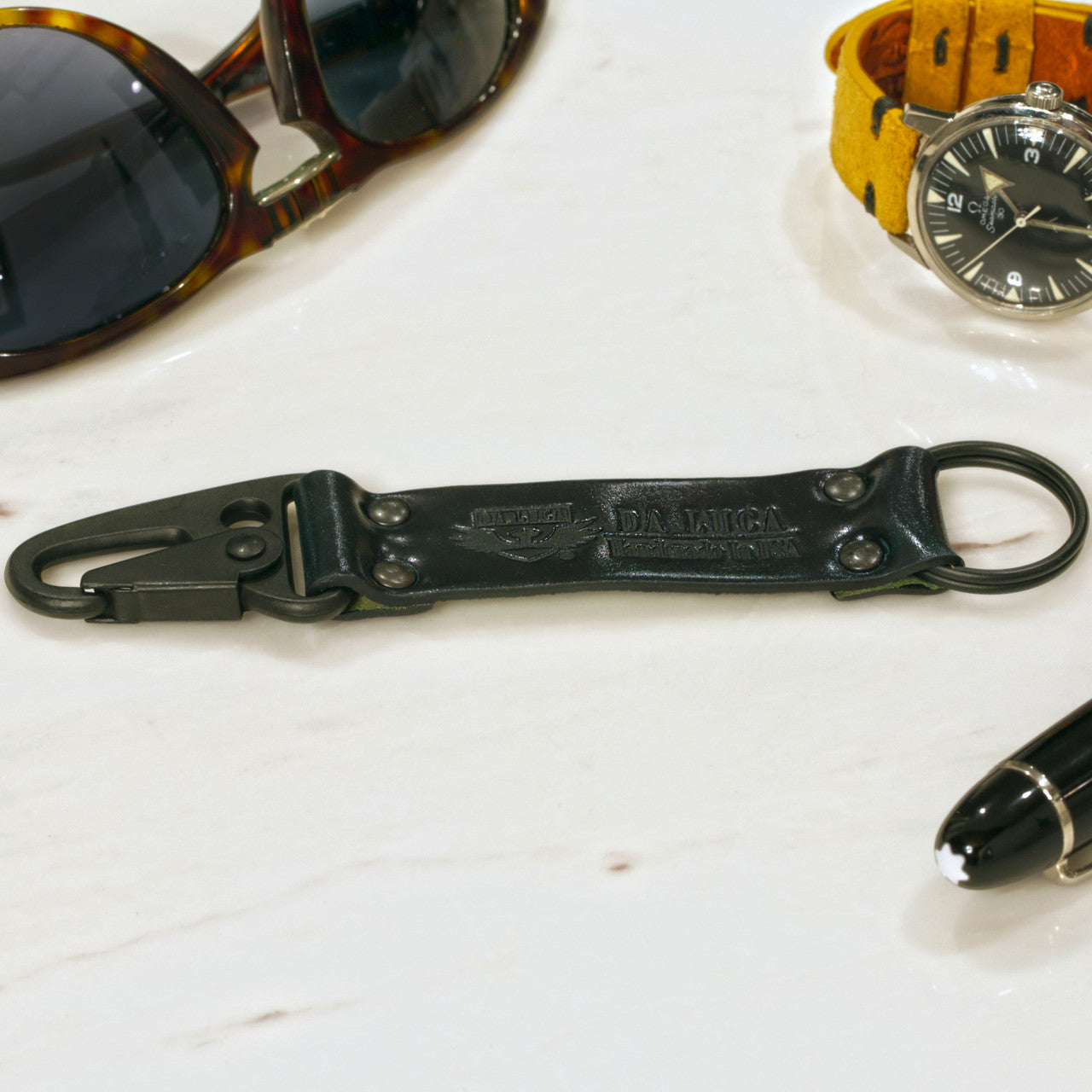 Close View Of Our Keychain Made From Genuine Horween Navy Shell Cordovan Leather and PVD Hardware by DaLuca Straps.