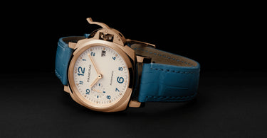 panerai luminor due gold watch with white dial and blue watch strap