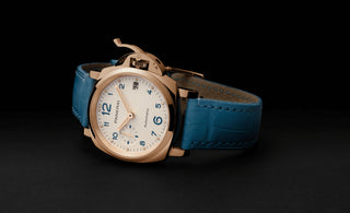 panerai luminor due gold watch with white dial and blue watch strap