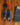 Leather dress shoes and accessories laid out on a wooden floor