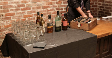 Single malt Scotch whisky bottles at a tasting table