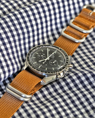 omega speedmaster pro watch on a nylon watch band