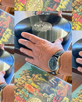 vinyl and beatles with a watch and leather watch band