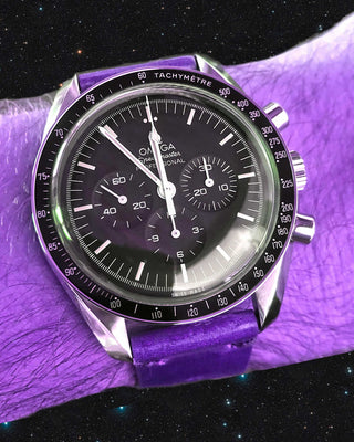 purple omega speeedmaster pro watch in space on a wrist