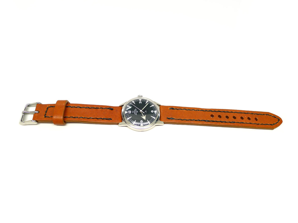 Eventure watch strap in orange with dark edge stitching, shown fitted to a watch.