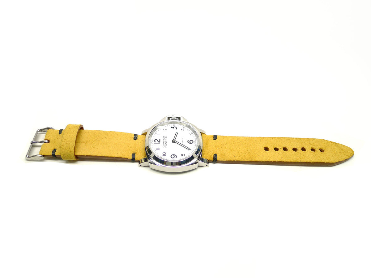 Fayluhn watch strap in yellow with a textured surface and dark accent stitches, shown fitted to a watch.