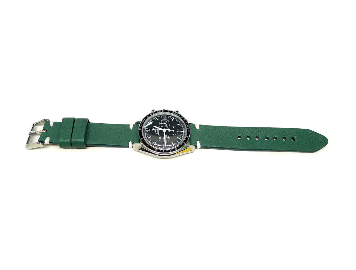 Fernz watch strap in green with white accent stitches, shown fitted to a watch.
