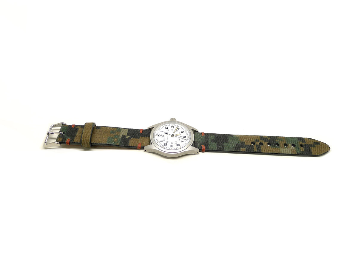 Fleet watch strap in green and brown with a block camouflage pattern and orange accent stitches, shown fitted to a watch.