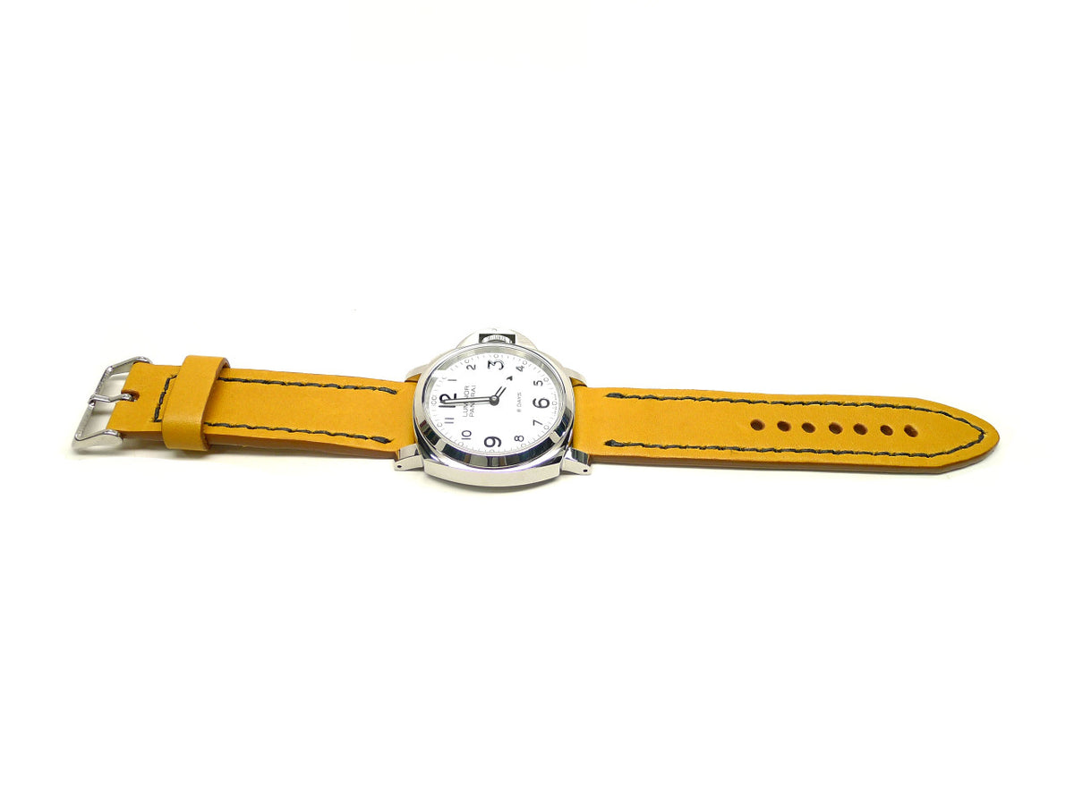Geinluh watch strap in yellow with dark edge stitching, shown fitted to a watch.