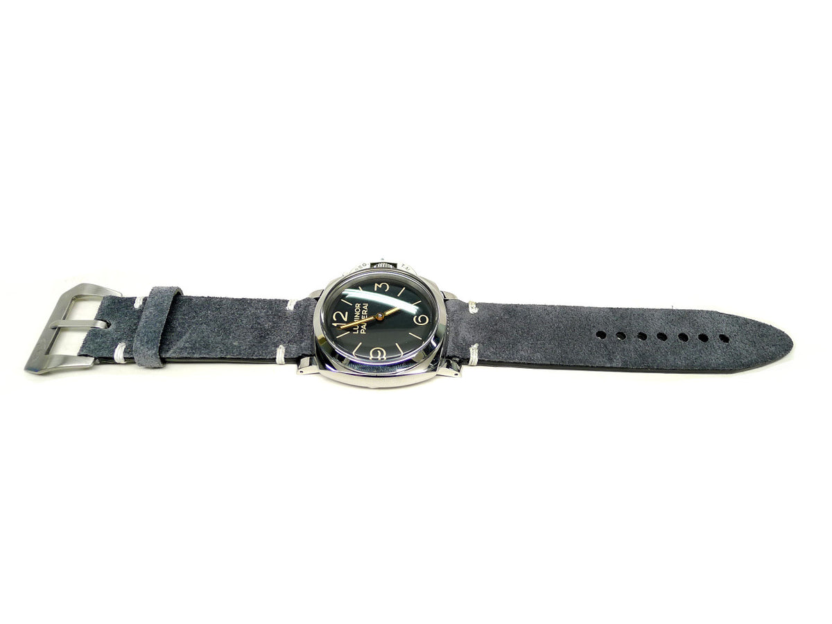 Natta watch strap in charcoal gray with a textured surface and white accent stitches, shown fitted to a watch.