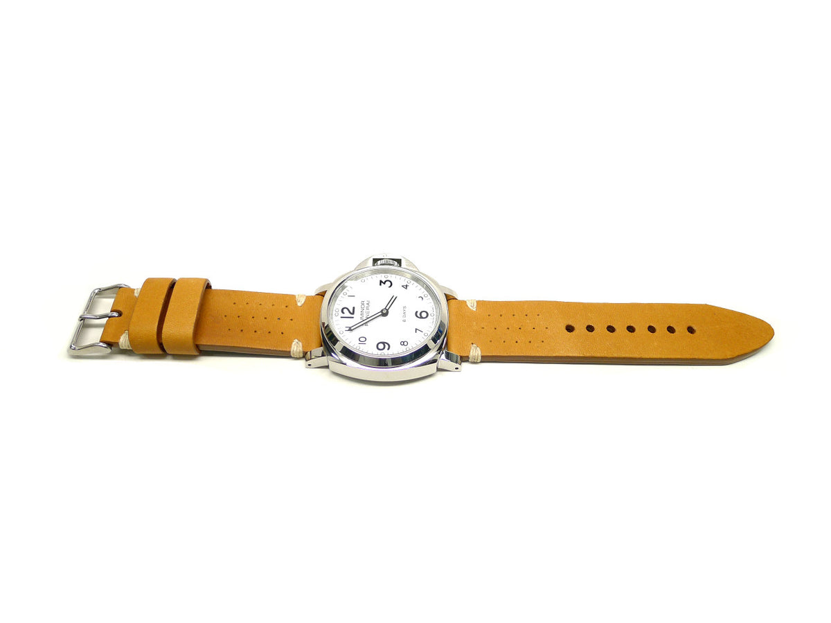 Optix watch strap in yellow with small perforations and cream accent stitches, shown fitted to a watch.