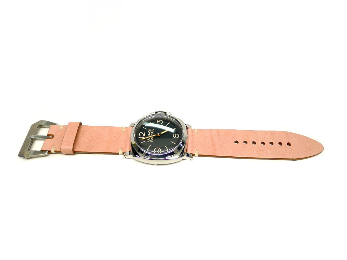 Porcus watch strap in pink with cream accent stitches, shown fitted to a watch.