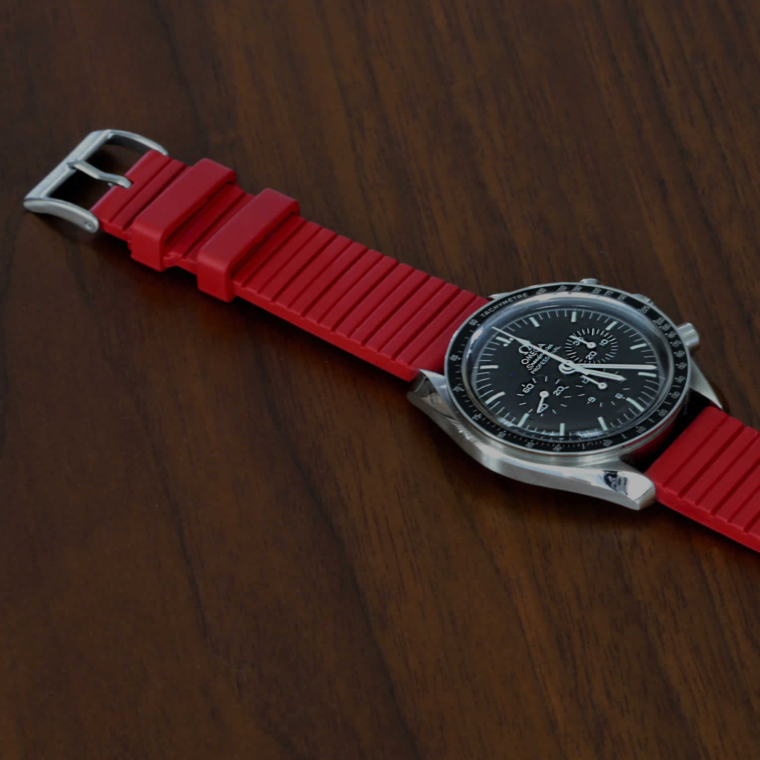 red rubber fkm watch band on an omega speedmaster pro watch
