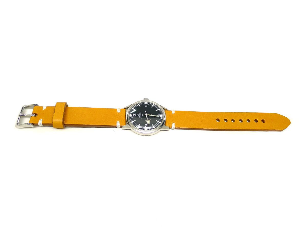 Saung watch strap in yellow with white accent stitches, shown fitted to a watch.