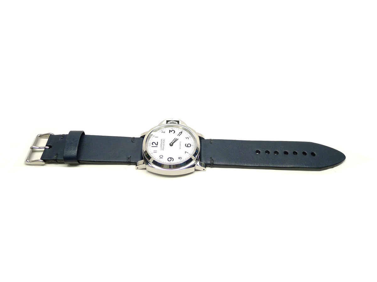 Verdeno watch strap in dark blue with dark accent stitches, shown fitted to a watch.