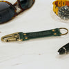 Close View Of Our Keychain Made From Genuine Horween Green Shell Cordovan Leather and Antique Brass Hardware by DaLuca Straps.