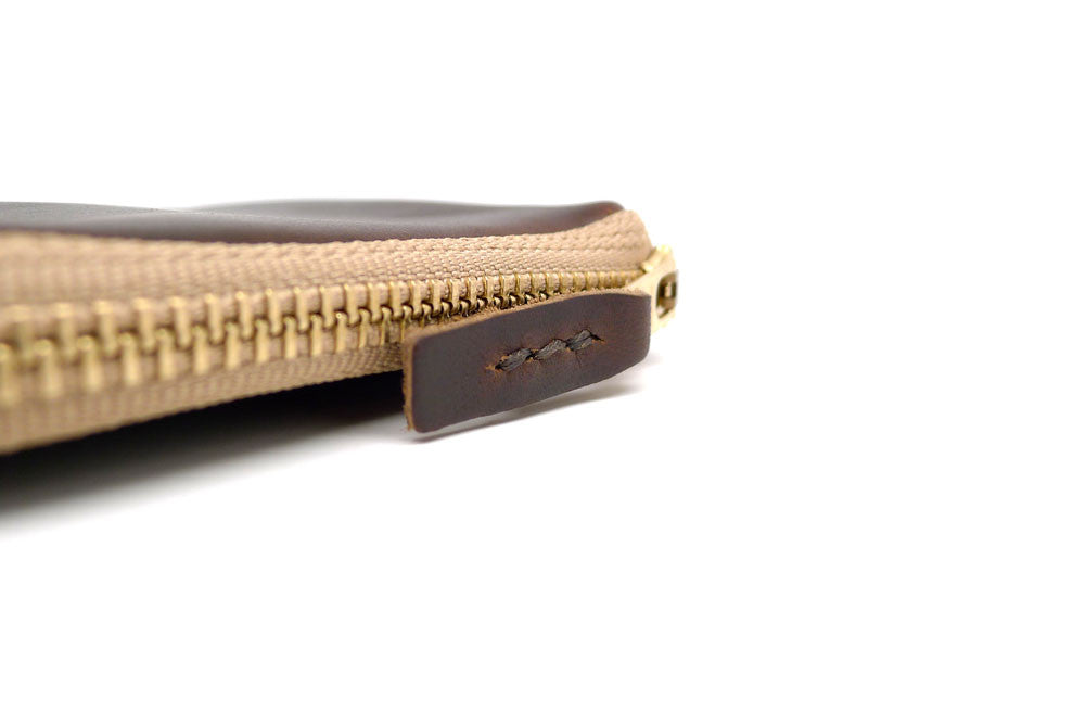 Pull Detail Of A Handmade Zip Wallet Made From Horween Brown Chromexcel Leather with a Khaki Zipper DaLuca Straps.